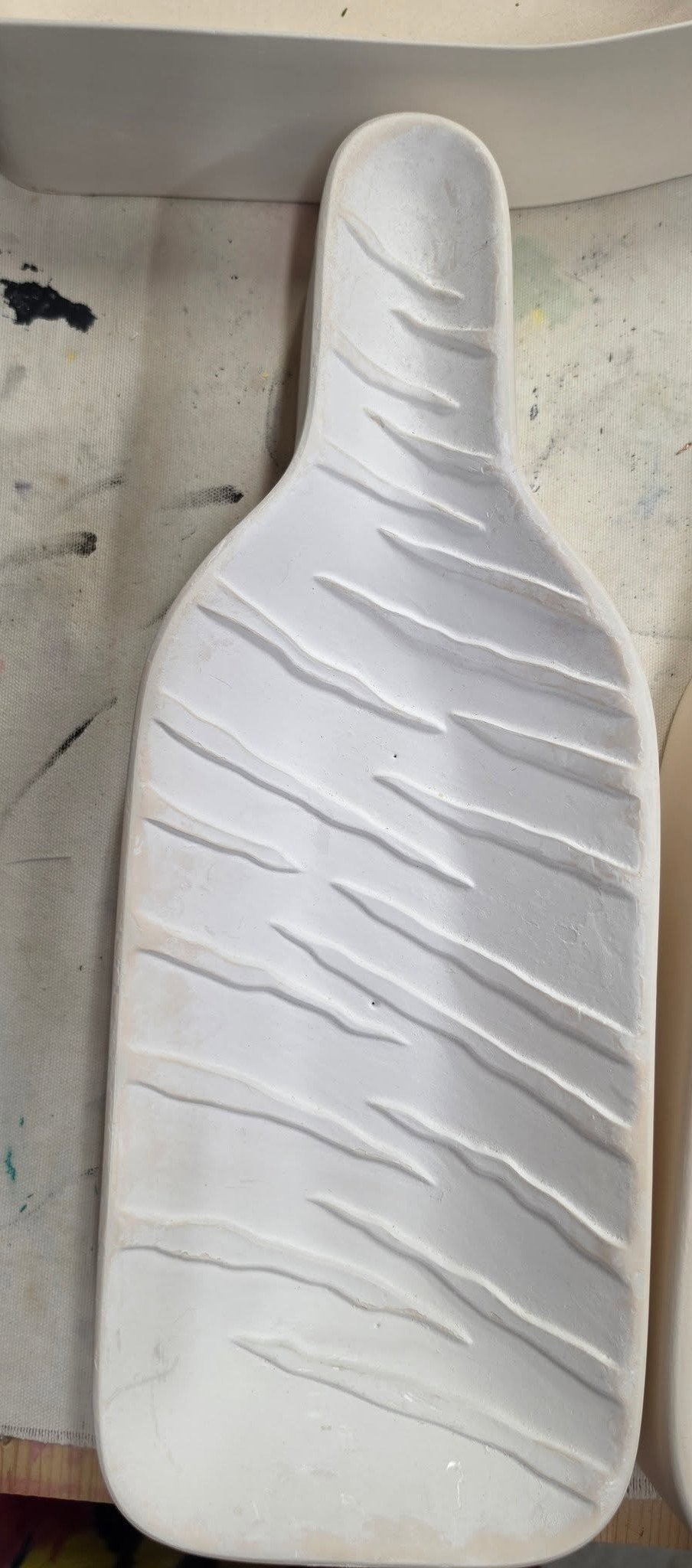 White bisque bottle slumping mold used for glass fusing